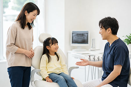 歯科医師に相談をする親子